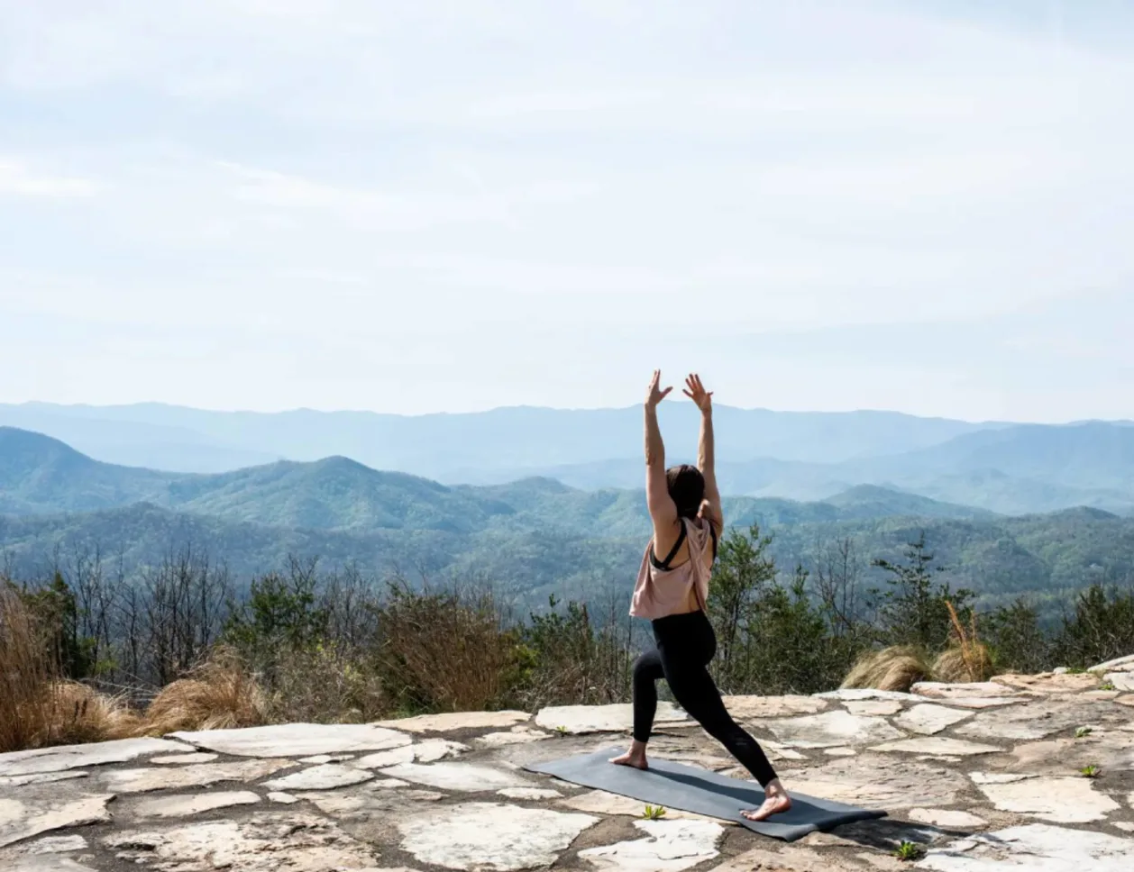 Guest doing yoga at Blackberry Mountain